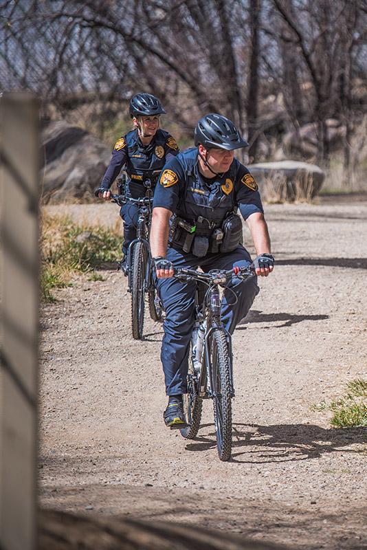 Prescott Police Bike Patrol Riding down dirt path