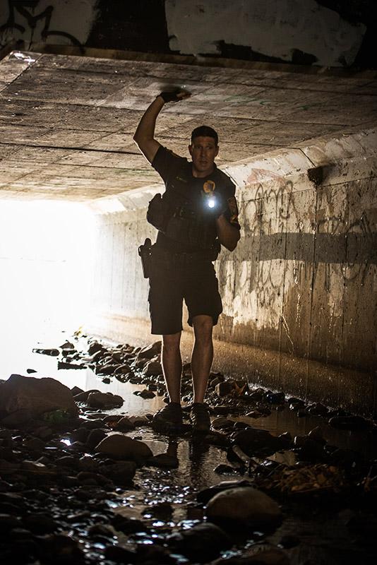 Prescott Police Officer in Tunnel with Flashlight