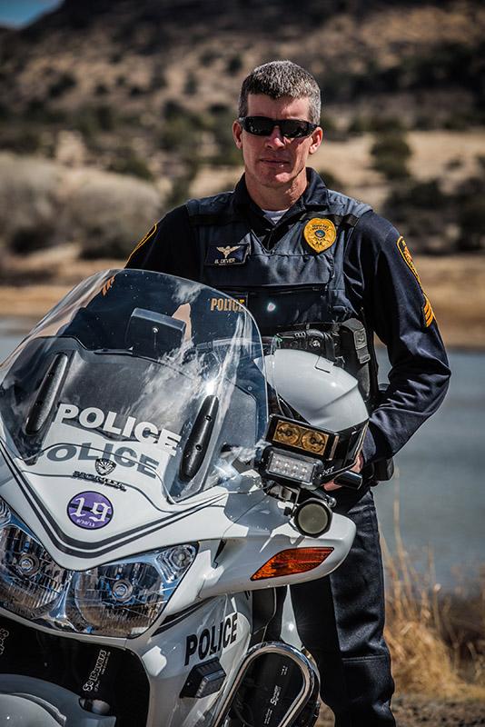 Prescott Police officer standing next to his motorcycle