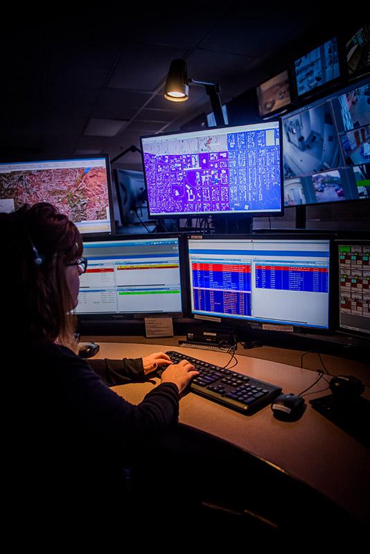 Comm Center Computer Screens and Officer